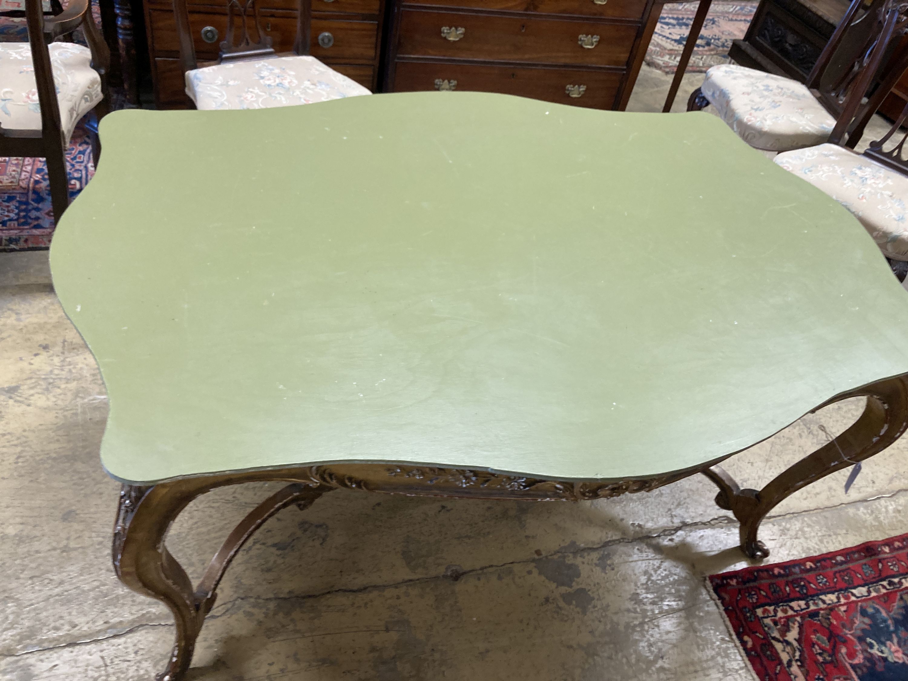A large 19th century gilt carved wood and plaster cente table (lacking top), width 150cm, depth 85cm, height 72cm
